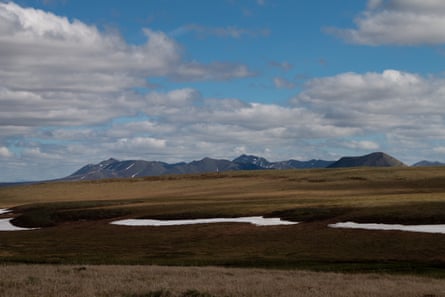 The Brooks Range peeks out from behind the sprawling tundra of northern Alaska
