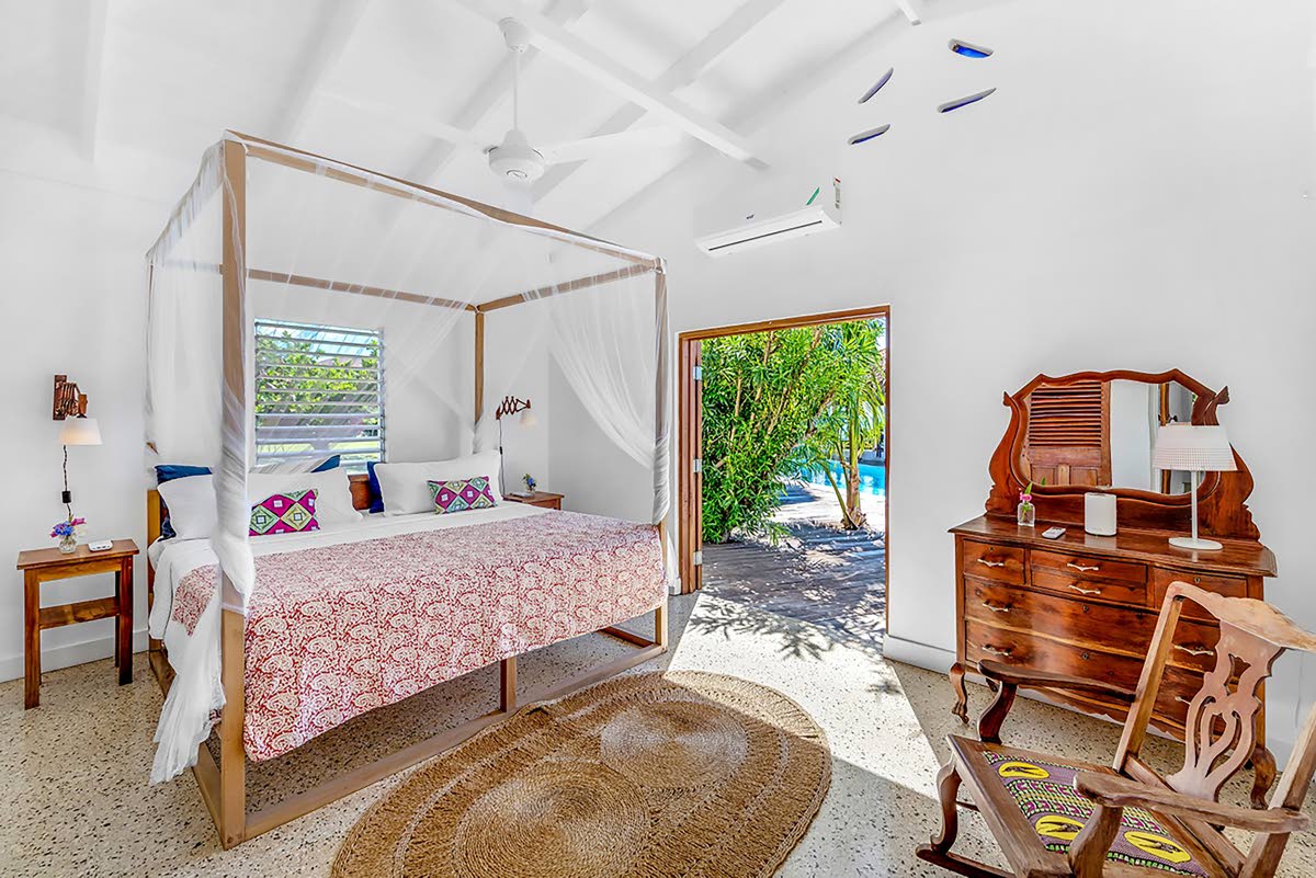 A peaceful bedroom in a seafront setting.